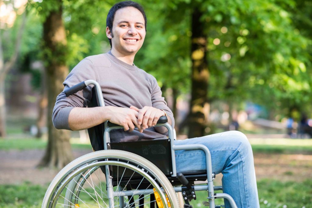 Smiling man in a wheelchair